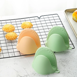 Silicone mini oven mitts pinch grips heat resistant kitchen pot holders in green and orange.