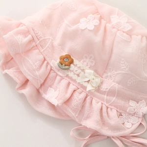 Pink infant lace sun hat with floral embroidery and bow detail for baby girls
