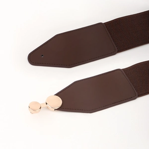 Detail of brown elastic waist belt with leather ends and gold metal snap fastener