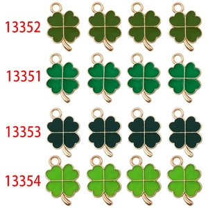 Four green four-leaf clover charms in different shades for DIY jewelry and accessories