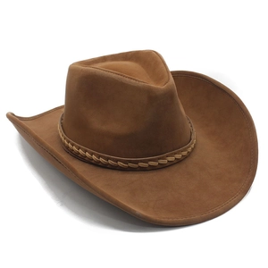 Detail of a brown suede cowboy hat featuring a braided leather band and pinch front crown
