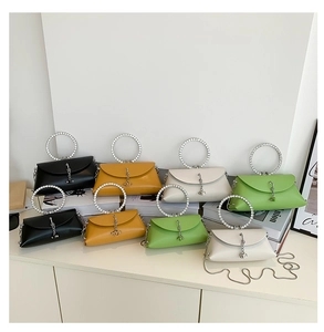 Detailed view of fashionable jelly bags with rhinestone ring handles in four vibrant colors
