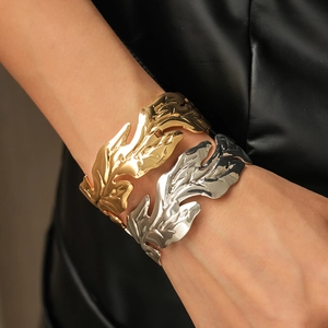 Minimalist metallic leaf open cuff bracelets in polished gold and silver finishes
