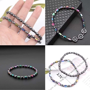 Rainbow hematite beaded bracelet with star charms and 2.75 inch diameter size guide