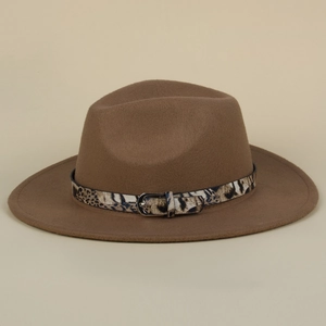 Close-up of brown wool fedora hat featuring a stylish leopard print leather belt with silver buckle