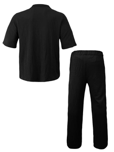 Close-up of the seersucker texture on black short sleeve shirt and long pants set