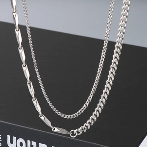 Silver stainless steel double-layered necklace featuring Cuban links and bar chain design