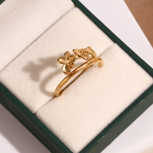 Detailed close-up of 18K gold-plated double-layer floral ring in a luxury jewelry box