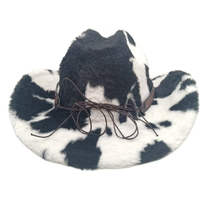 Close-up of cow print cowboy hat showing soft plush texture and brown leather strap detail
