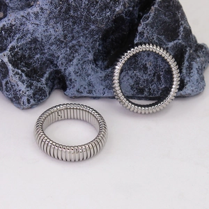 Adjustable silver stretch ring with industrial geometric threaded links on a stone base