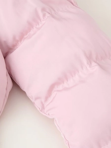 Close-up of pink quilted fabric texture and precise stitching on the hooded parka jacket