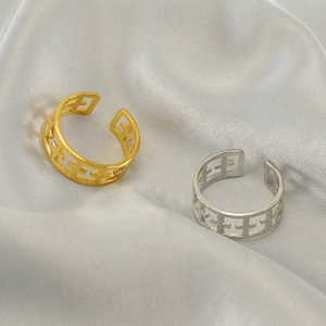 Adjustable titanium steel ring with hollow cross pattern in gold and silver finishes