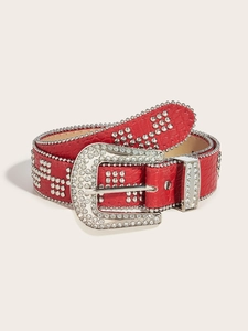 Detailed view of red croc-embossed punk belt with silver studs and rhinestone buckle