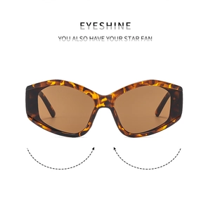 Macro detail of tortoiseshell irregular oversized sunglasses with flexible temple hinges