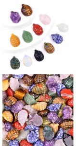 Detailed view of hand-carved hedgehog-shaped natural amethyst and agate gemstones