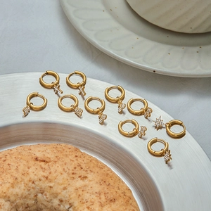 Golden stainless steel hoop earrings with hanging cross butterfly and star charms