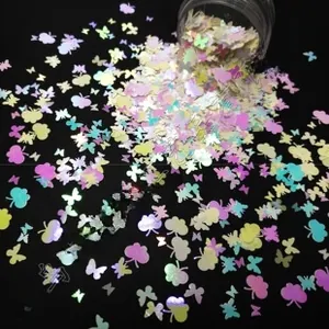 Macro detail of iridescent butterfly and flower sequins in a jar for nail art DIY