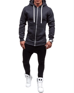 Front view of dark grey slim-fit zip-up hoodie with white drawstrings on a model