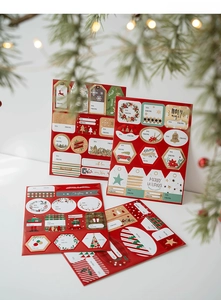 Detailed view of Christmas gift tags with reindeer and tree patterns on red background