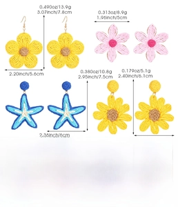 Detailed view of raffia earrings set including yellow flower and blue starfish designs