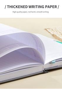 Close-up of thickened writing paper detail and lavender calendar layout on grey notebook