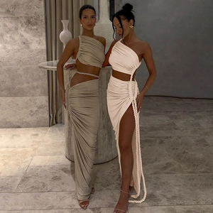 Detail of one-shoulder cutout maxi dress featuring side ruching and rope ties