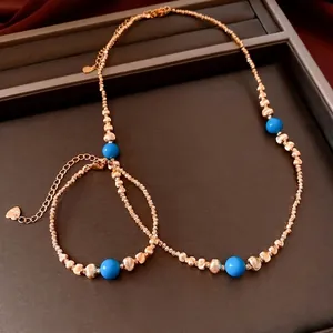 Ensemble de bijoux plaqués or 18 carats avec perles bleues et pendentif cœur