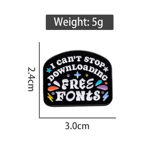 Black enamel font brooch with funny text and colorful stars on a white background