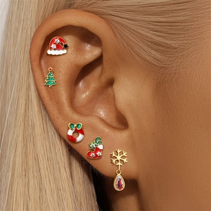 Detailed close-up of a 5-piece S925 silver Christmas earring set worn on ear