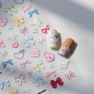 3D embossed nail stickers featuring pastel bows, hearts and butterflies for sweet manicures