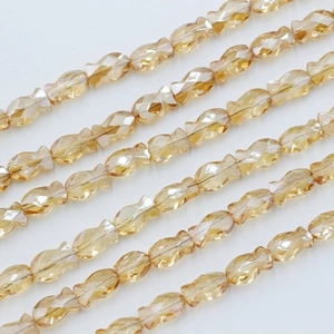 Strands of 6x10mm faceted fish-shaped amber crystal glass beads for jewelry making