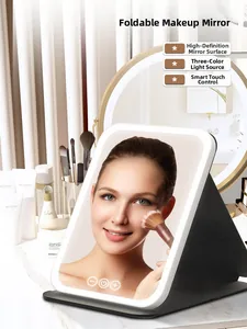 Close-up of portable LED makeup mirror with three-color touch lighting and folding stand