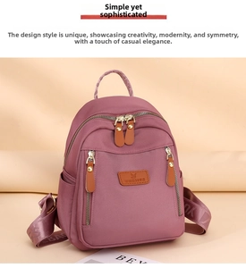 Close-up of waterproof purple nylon backpack featuring leather zippers and multi-pocket design