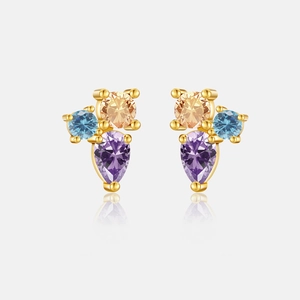 Detail of drop-shaped gold earrings with purple pear-cut and blue-yellow round stones
