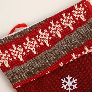 Christmas stocking gift bag with red knit fabric, burlap texture, and white snowflake detail