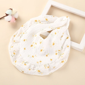Bavoir bébé en gaze de coton doux avec imprimé floral jaune délicat et bord à volants
