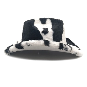 Detailed view of plush cow print texture on a warm winter western cowboy hat style