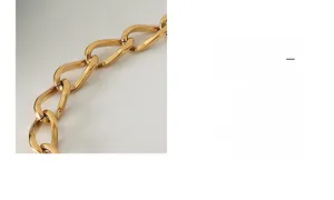 Close-up of 18k gold plated titanium chain bracelet with twisted link design