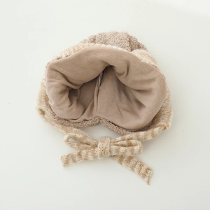 Detail showing the skin-friendly inner lining and knit texture of the baby warm hat