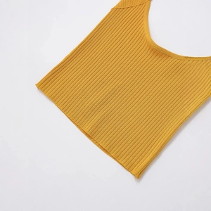 Sexy yellow ribbed knit halter top for women in a stylish cropped minimalist fit