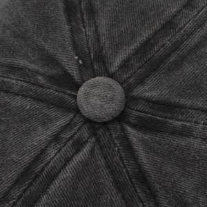 Close-up of the dark grey cotton twill cap top featuring a fabric-covered button and seams