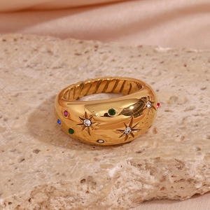 Detail view of a 18K gold-plated dome ring with colorful stones and star engravings