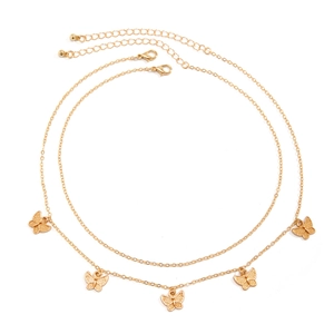 Detail of double-layer gold butterfly necklace featuring five pendants and lobster clasp