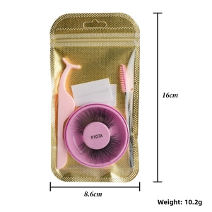 Self-adhesive false eyelashes kit with pink tweezers and brush in gold packaging