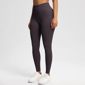 Detail of high-waist seamless yoga leggings with tummy control in deep purple matte fabric