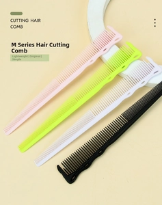 Detailed view of hair cutting combs in four colors with fine teeth and wavy non-slip grip