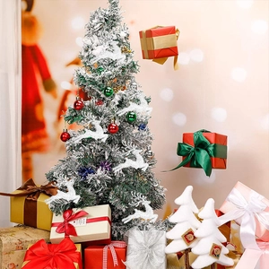 Close-up of festive Christmas tree decorated with silver reindeer and colorful ornaments