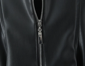 Close-up of metallic silver zipper and stitch details on black PU leather dress