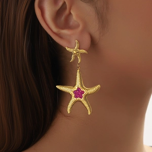 Starfish gold drop earrings with purple gemstones and detailed engraving for women