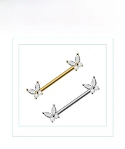 Détail des piercings téton papillon sertis de zircons marquise et ronds brillants